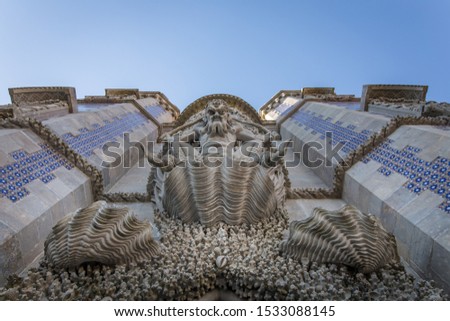 A picture of the triton at the entrance of the Pena Palace in Sintra, Portugal from below to top with the details of the half man half fish  mythological monster.  