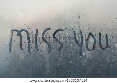 The inscription on the misted glass miss you