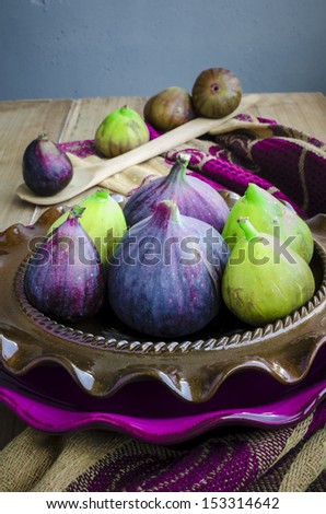 Purple and green Figs on the ceramic plate