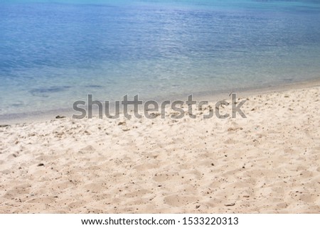 Soft wave of blue ocean on sandy beach. Background.Sandy beach near sea on sunny day.