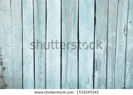 Sawing wood of different breeds. Background of old and new wooden boards. Sky blue texture of natural old wood. Use for furniture production, design and manufacture of laminate