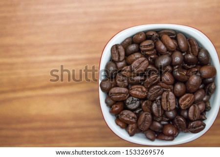 Close up texture of coffee beans in a glass.