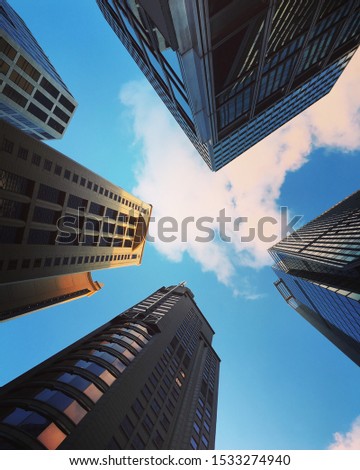 Modern business skyscrapers, high-rise buildings, architecture raising to the sky background. Concepts of financial, economics, future, growth