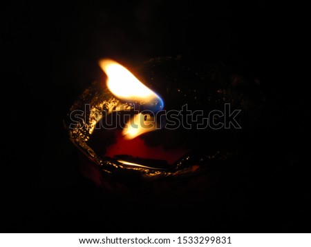 candles burning in the dark for wallpaper or background 