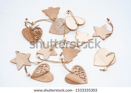 Three Handmade wooden Christmas trees on white background. Christmas decorations, toys, gifts or souvenirs
