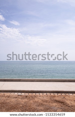 summer beach with sand sea side and seascape view , blue sky with cloudy .