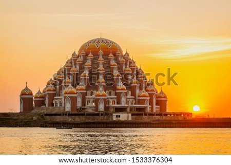 Masjid 99 Kubah (99 Domes Mosque), a beautiful Mosque with unique architecture, located in famous destination, Losari Beach, Makassar, South Sulawesi, Indonesia. A new Landmark of Makassar City, Royalty-Free Stock Photo #1533376304