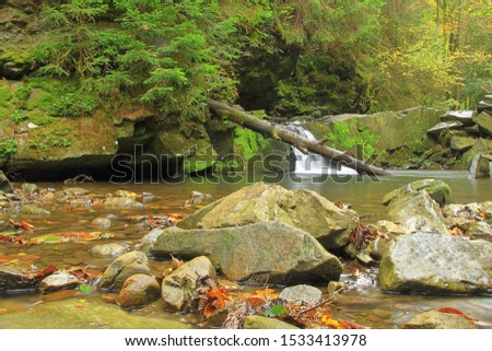 Photo taken in Ukraine in the autumn. In the picture there is a waterfall in the Carpathian mountains called - girlish tears.