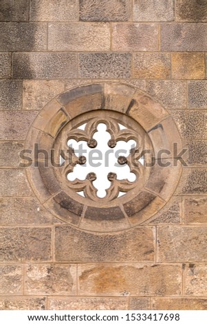 Elements of architectural decoration of buildings, old doors and arches, windows and patterns on the streets in Barcelona, public places.