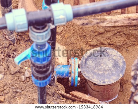 Plastic and steel pipes and valves underground. Repairing of main branch of town water delivery system