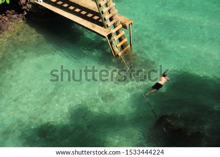 A man swimming in the To sua ocean trench