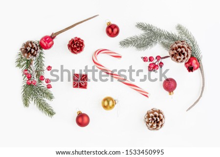 Christmas composition with tree branches, red berries, balls and  gifts isolated  on white background. Christmas, winter, New Year concept. Flat lay, Top view.