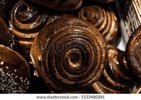 Various breads sitting on a large shelf stock photo