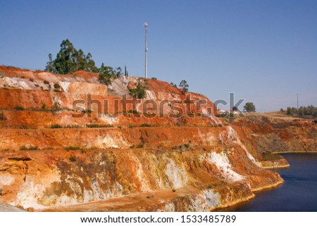 Copper and silver outdoor mines with iron-dyed red lake  Sao Domingo Mines Mertola Portugal