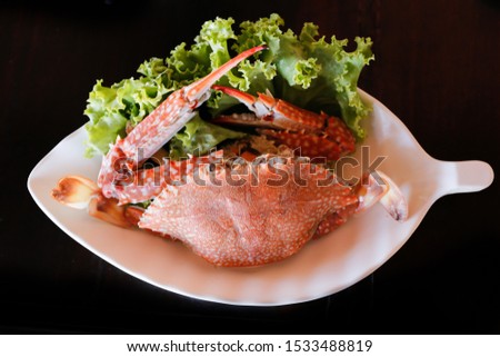 horse crab or blue crab in white plate. Seafood in Thailand. Close up.