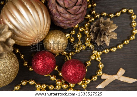 red and gold Christmas toys, Christmas tree and cones