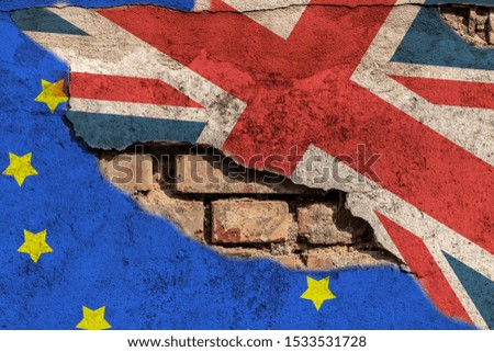 Flags of Britain and the EU on a broken wall