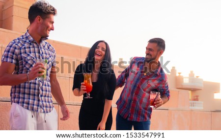 Millennials young people having fun celebrating in the discoteque. Happy friends drinking cocktails in the party. Entertainment and festive holidays concept - Image