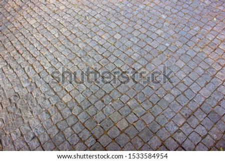 Background of stone floor texture. Pavement on walkways in the park.