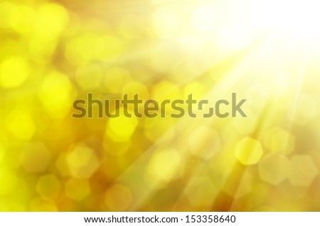 Natural outdoors bokeh  in golden autumn tones with sun rays Royalty-Free Stock Photo #153358640