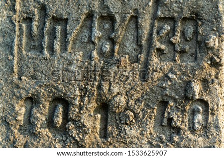 Letters deep on cement concrete