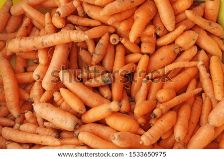 Fresh organic carrots. Carrot full frame picture. Carrots pattern. Orange food background. 