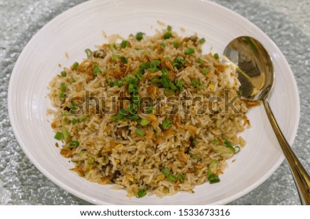 Popular traditional chinese cuisine with a western touch / Foie Gras Fried Rice / Noticed the rice do not stick in a lump because they fried it raw and has a distinct biting sensation