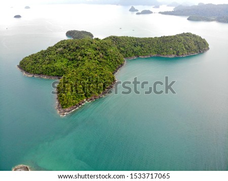 Amazing trip by jetski around Beras Basah, Kentut Besar, Diamond islands and beaches. The bird flight view on the reserved forest and hills, Langkawi, Malaysia.