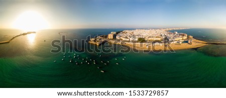 Aerial panoramic view of Caleta beach and the road to San Sebastian Castle from Cadiz, Andalusia, Spain 