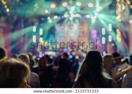 Silhouette hands of audience crowd people enjoying the club party concert ,Celebrate party , Blurry night club party music dancing sound , Party People Blurred Background-Crowd at concert and blurred
