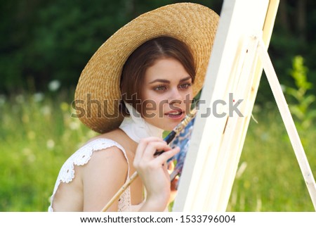 young woman in a beautiful summer straw hat