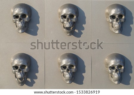 Multi colored skulls on wall