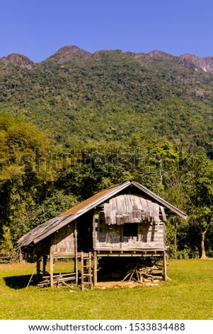 old wooden house in the mountains, digital photo picture as a background