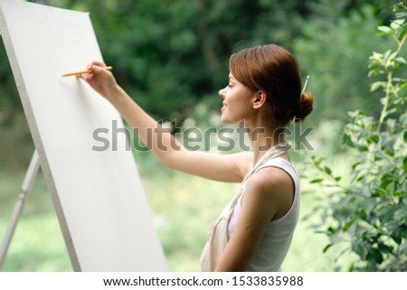 beautiful easel woman with white canvas