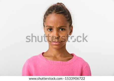 Image closeup of confused african american girl looking at camera isolated over white background