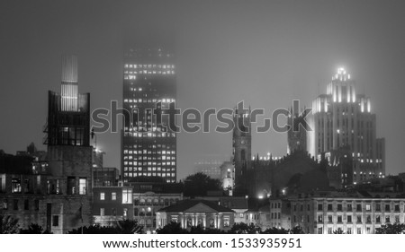 Downtown with lots of mist  at night