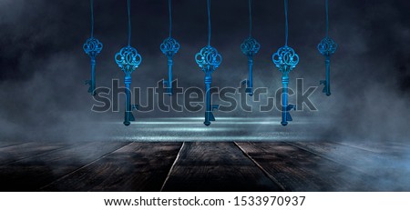 Dark room and wooden table. Blue neon smoke. Garland of old keys.