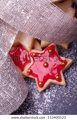 christmas star cookies with red jelly and powder sugar