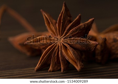 Food Background with Close-up of Star Anise on Vintagewood Table. Selective Focus.