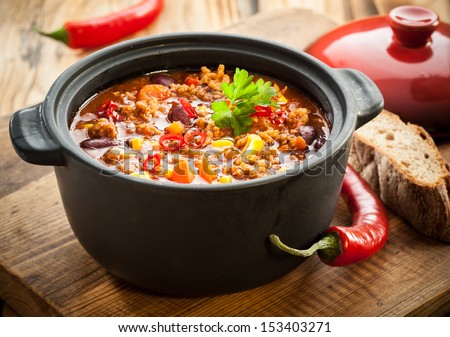 Tasty spicy chili con carne casserole in a pot for those winter nights, high angle view Royalty-Free Stock Photo #153403271