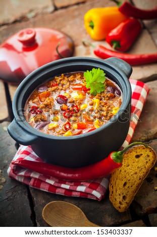 Tasty spicy chili con carne casserole in a pot for those cold winter nights, high angle view Royalty-Free Stock Photo #153403337