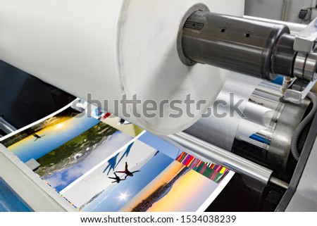 lamination machine laminating offset print roll with plastic foil Royalty-Free Stock Photo #1534038239