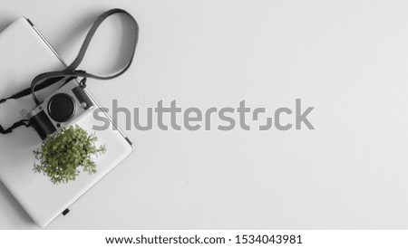 White Background Template with Laptop, Camera and Small Pot