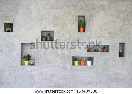 Shelf in wall with flowerpots decoration