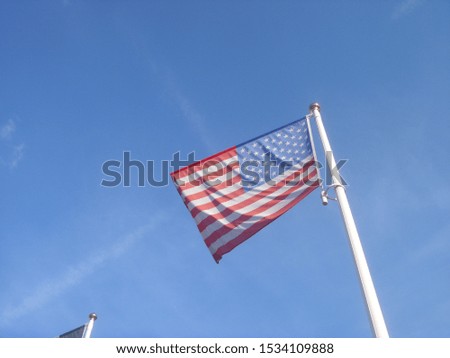 USA national flag under blue sky