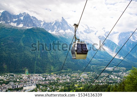 Cable car traveling over Chamonix in Mont Blanc area in France with the mountain panoramic view.  Royalty-Free Stock Photo #1534136339