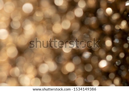 A portrait of a nice small gold color bokeh background. The golden blur is something magical.
