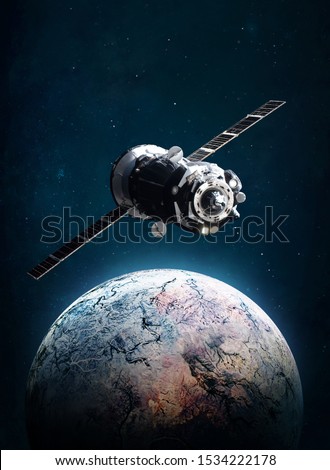 Cargo space ship on orbit of the planet. Exploration and colonization science theme. Dark background. Elements of this image furnished by NASA