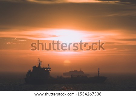 abstract photo of a ship transporter during fog and sunset Royalty-Free Stock Photo #1534267538