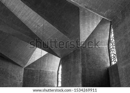 Black and White tone and mood, Detail of concrete ceiling with abstract geometric patterns and light pass through ornament of windows of brutalist architecture church in Cologne, Germany.  Royalty-Free Stock Photo #1534269911